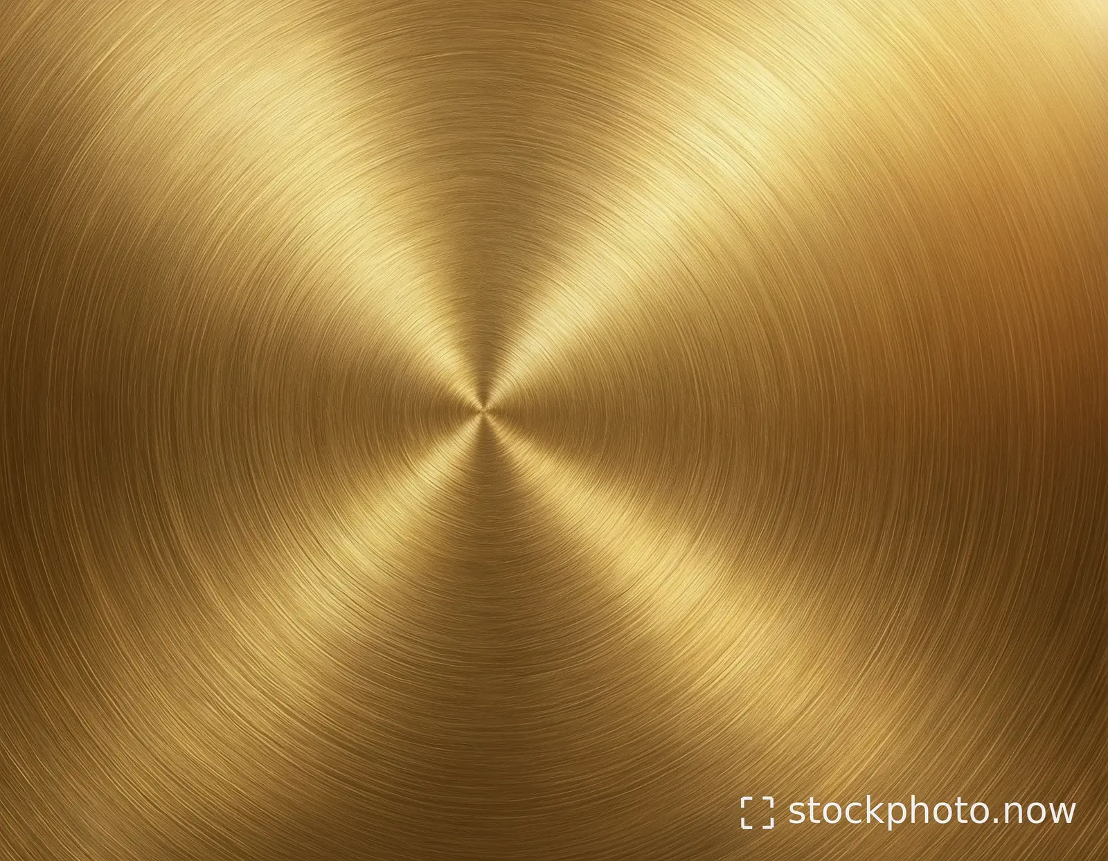 A warm gold metallic surface with fine circular brushed lines and reflected highlights