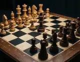 A close-up of a wooden chessboard with dark and light pieces arranged mid-game under soft lighting.