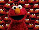 A cheerful red furry Elmo character smiles brightly surrounded by a repeating pattern of identical Elmo faces.