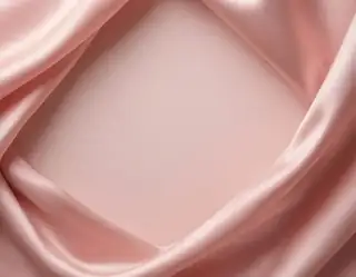 Blush pink satin folds framing a smooth pale pink center with open space for a design
